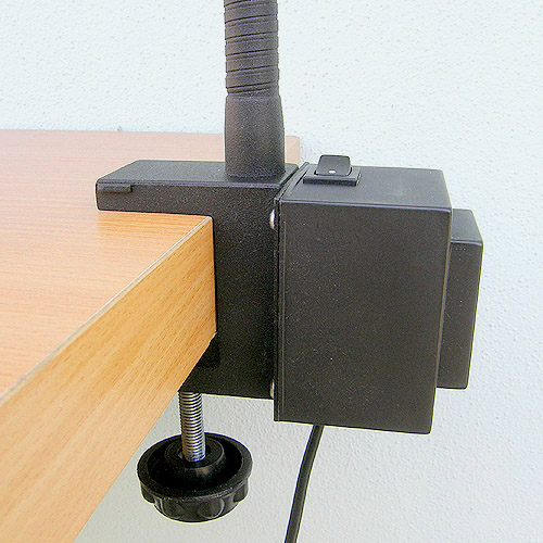 Lamp gripped to the table with a clamp